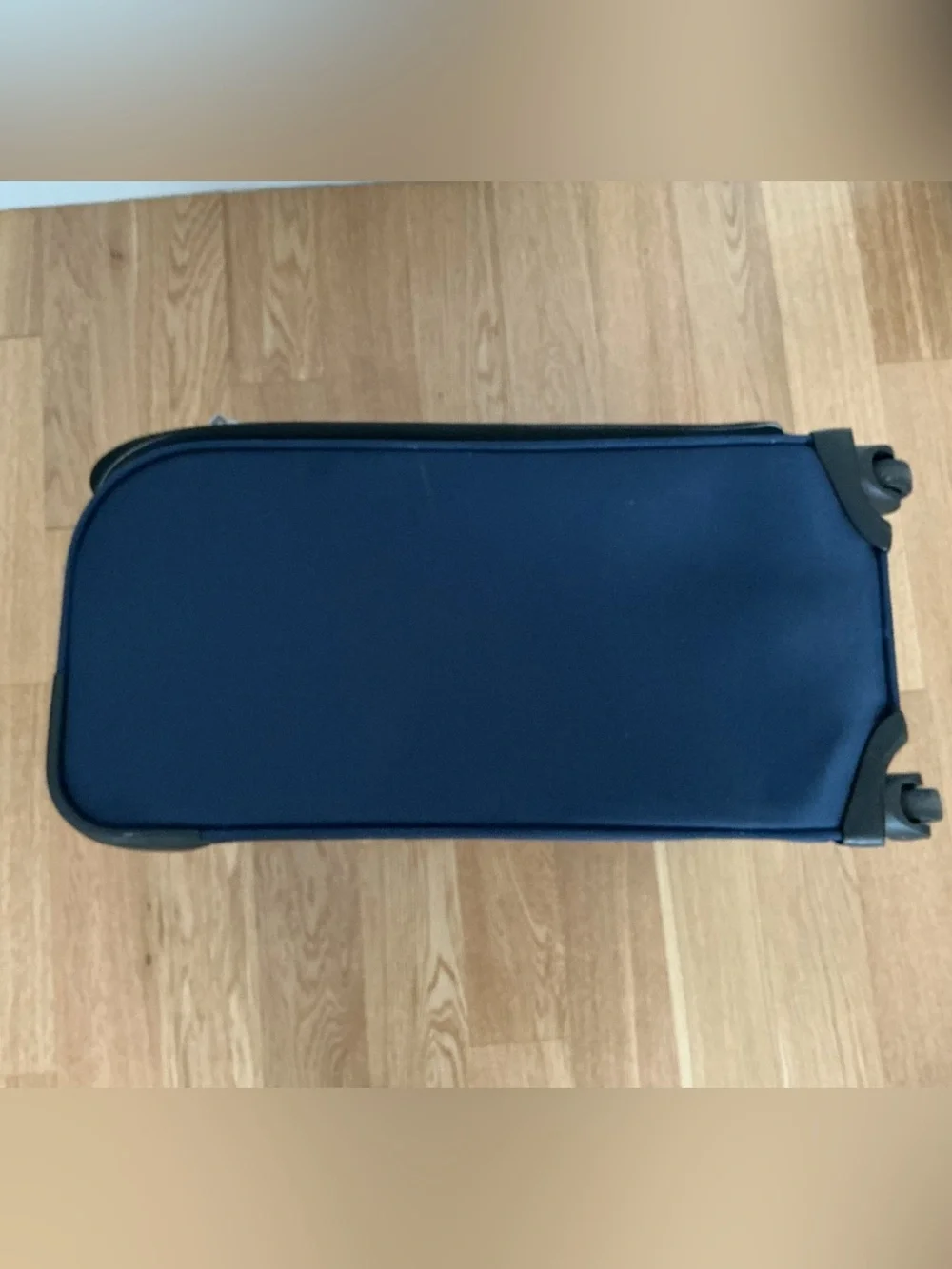 Samsonite Optimum softside spinner carry-on suitcase.